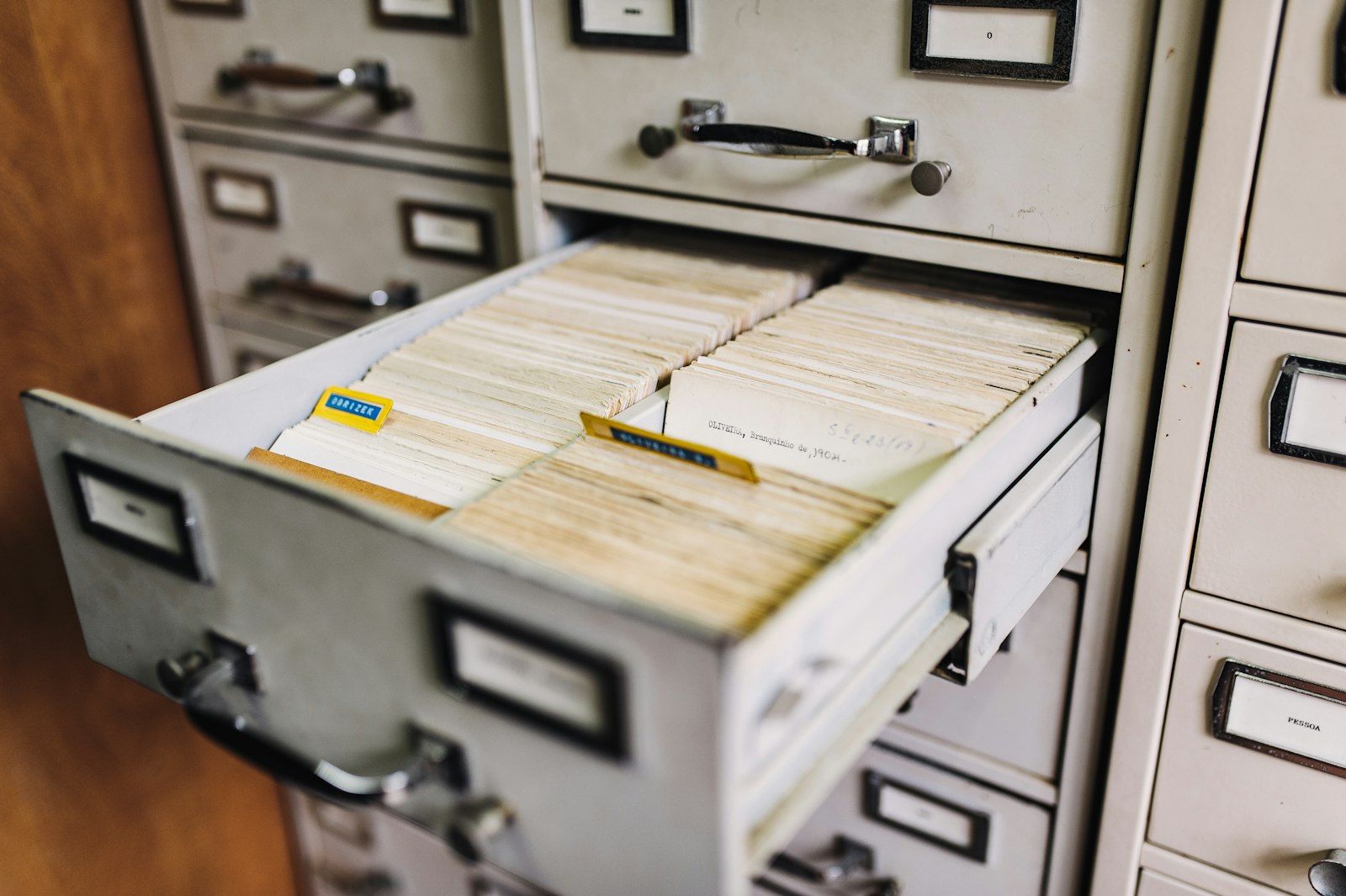 Open archive drawer of filed records, representing a Costa Rica land title search at the Registro Nacional